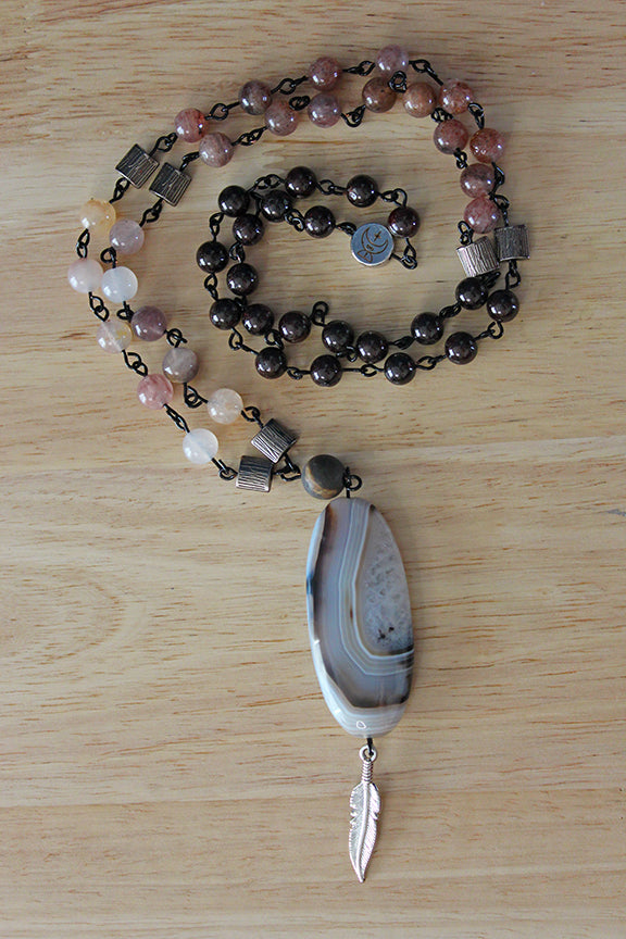 Rooted Feather Amulet