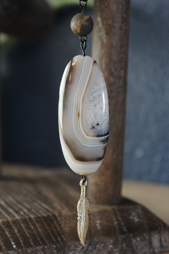 Rooted Feather Amulet