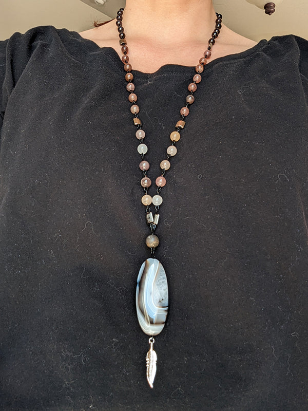 Rooted Feather Amulet